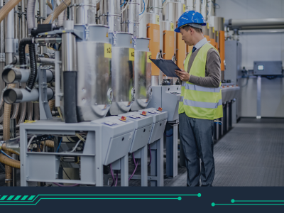 Image shows a man in a production facility making checks 